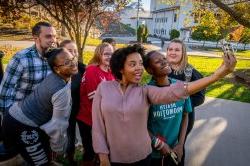 Photo of a group of students taking a selfie.