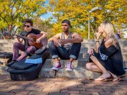 Photo of students playing guitar on main quad