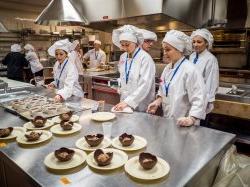 Photo of student chefs making desserts